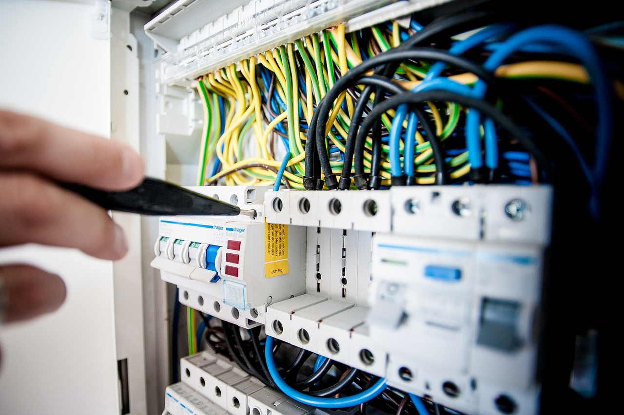 Electrician working on circuit breakers